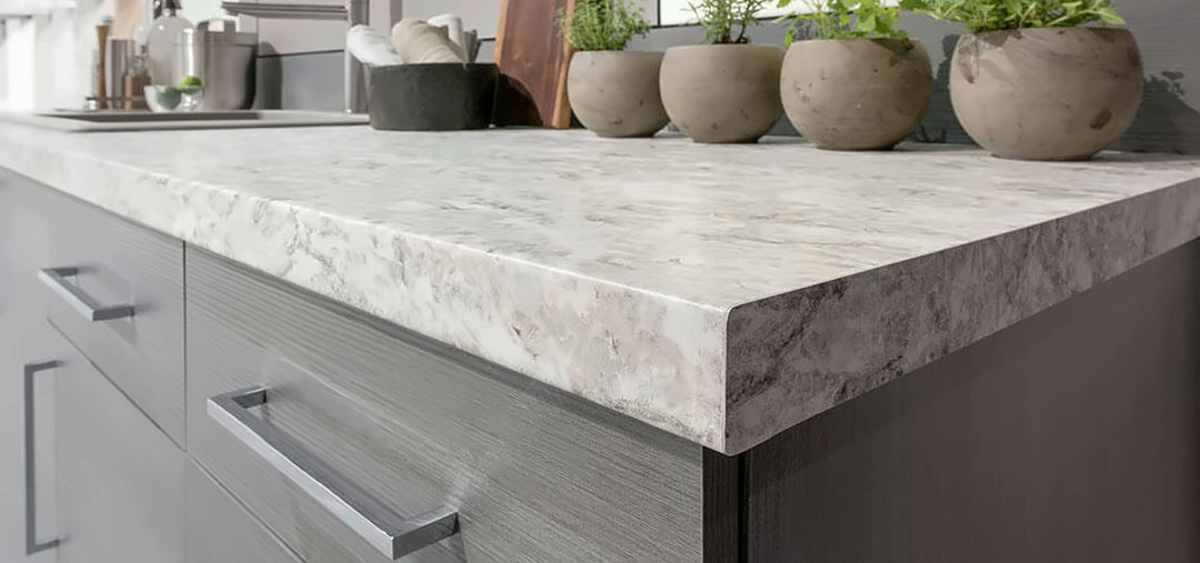 Stone-look laminate countertop on grey cabinets